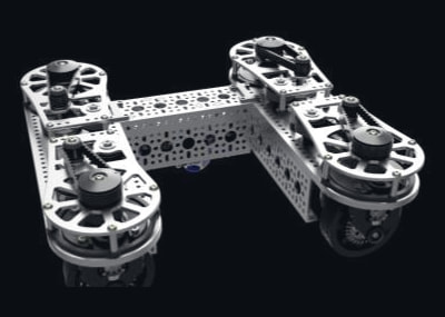 Swerve drive chassis: four corner modules with toothed belts and bevel gears on a silver frame